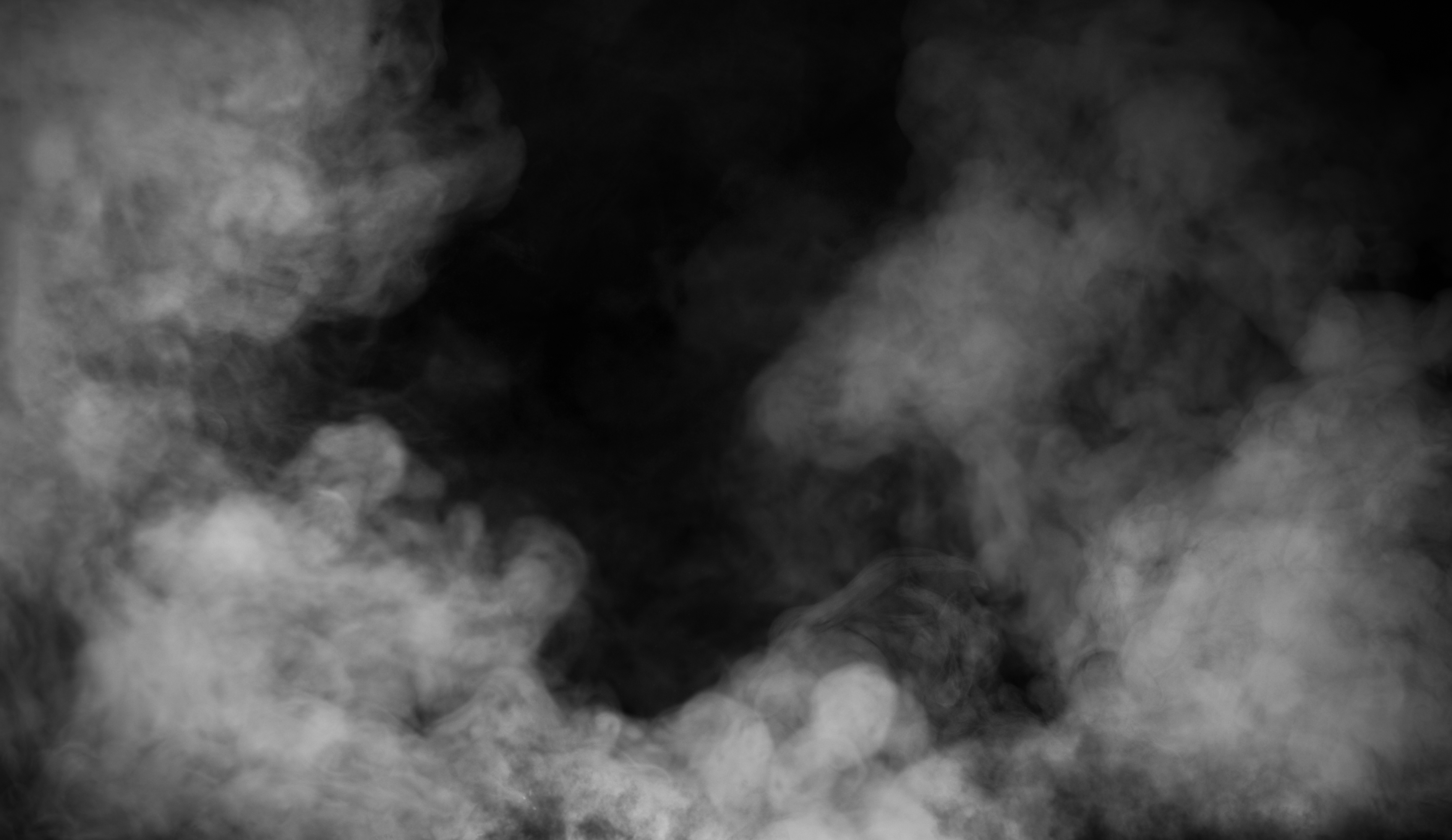 Close-up of hands shaking in black and white